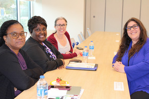 Picture of staff members sitting around a table